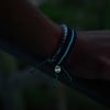 51641005000-4ocean-glow-in-the-dark-deep-sea-blue-braided-bracelet-lifestyle-3.jpg